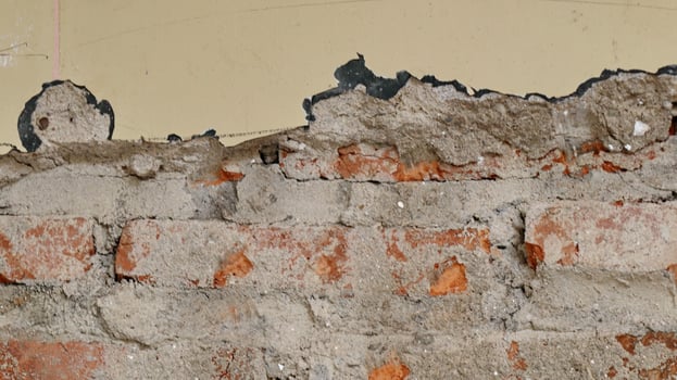 Wall with lining from bits of broken brick. Used as a background. photo