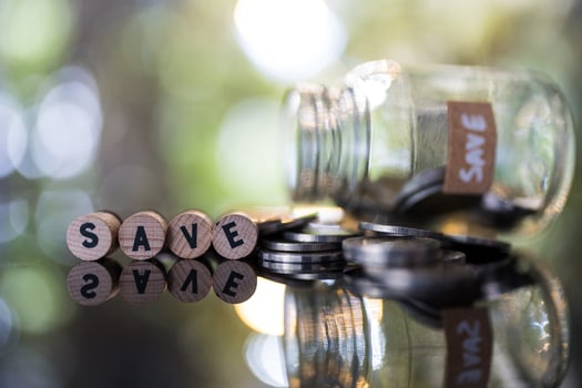 Money bank near, coins and wooden blocks spelling SAVE. Concept showing saving money. photo