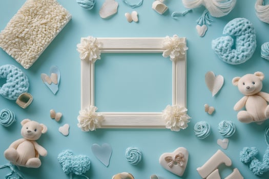 Baby boy nursery decoration surrounding empty frame on light blue background photo
