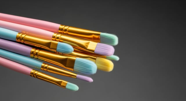 Colorful paint brushes with pastel handles for art, painting, and creative projects photo