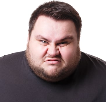 Angry fat man portrait, furious big guy expressing anger, white isolated studio background photo