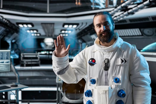 Astronaut waves hand during call with command center on Earth while stationed aboard spacecraft. Cosmonaut saluting researchers, doing mission update during communication link to ground control photo
