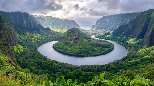 Aerial View of a Serpentine River Winding Through Lush Green Mountains in Kauai, Hawaii. photo