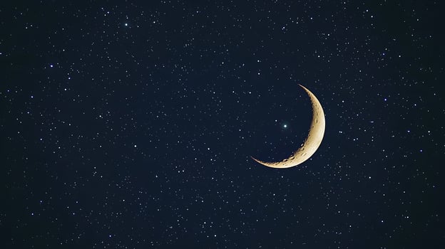 Crescent Moon in a Starry Night Sky A Celestial Landscape. photo