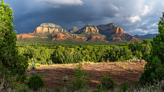Dramatic Sunset Over Red Rock Formations in Arizona's Sedona Landscape. photo