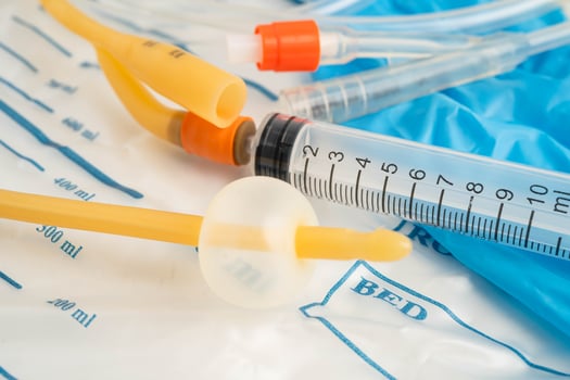Foley catheter and urine drainage bag collect urine for disability or patient in hospital. photo