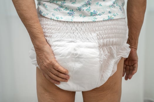 senior woman wearing adult incontinence diaper photo