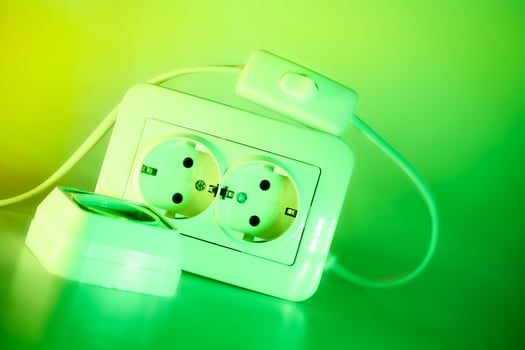 Two electrical sockets,connecting devices,switch in green light photo