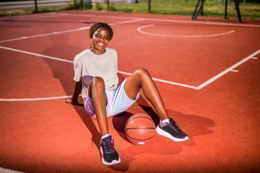 Happy basketball player looking at camera and smiling photo