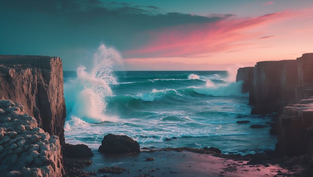 A sunset over the ocean with waves crashing into rocks photo