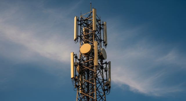 Telecommunication Tower with Antennas and Dishes Against Blue Sky for Global Connectivity photo