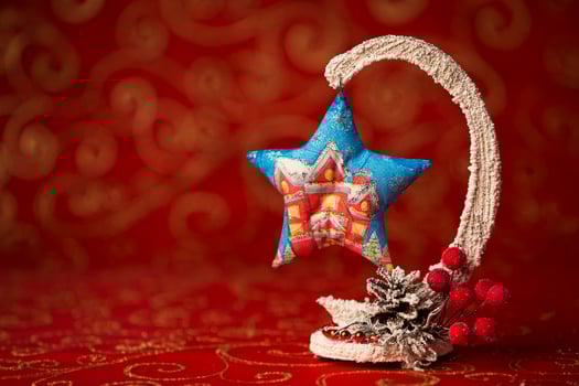 Christmas card. New Year decoration on a red background. Christmas tree toy. Rowan berries covered with snow photo