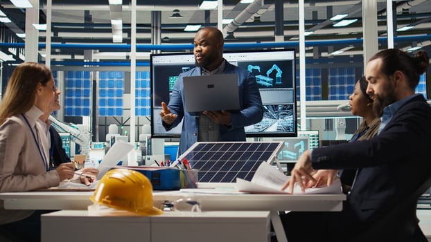Photovoltaics researchers evaluating solar cells to identify weaknesses and improve production. Solar panels factory experts optimizing tech for better energy absorption, camera A photo