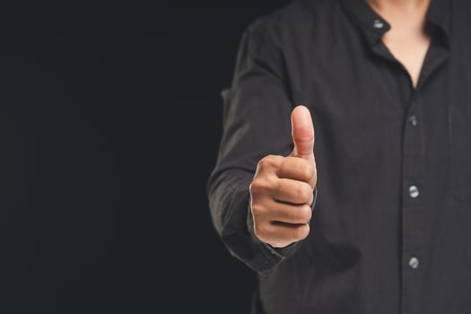 A man hand with thumbs up for best excellent services satisfaction photo