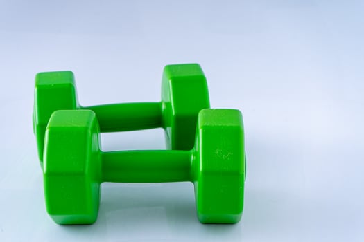 Two dumbbells 2 kg each. Sports equipment. White background. Gym photo
