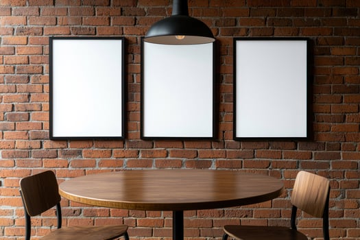 Empty frames on brick wall above cafe table photo