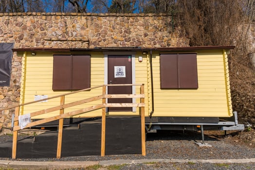 Prague, Czech Republic - March 8, 2025. Mobile podcast studio with wooden ramp and closed shutters photo