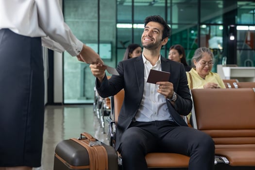 Businessman passenger is showing boarding pass to the airline ground crew at departure gate into the airplane for final inspection before boarding to plane photo