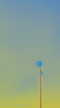 Abstracted Streetlight Against a Graded Sky with Blue and Yellow Hues photo