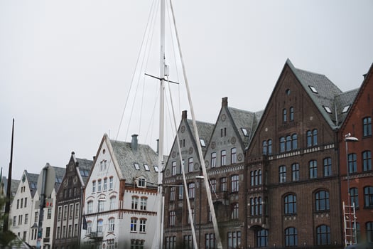 Bergen, Norway - July 10, 2024. Historic wooden buildings of Bryggen in Bergen - cloudy summer day photo