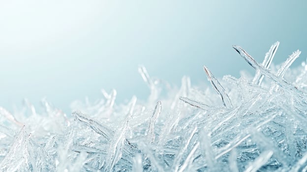 Delicate ice crystals forming. Sharp frozen shapes. Blue tinted background. Winter season details. Cold temperature. Sparkling crystalline texture. photo