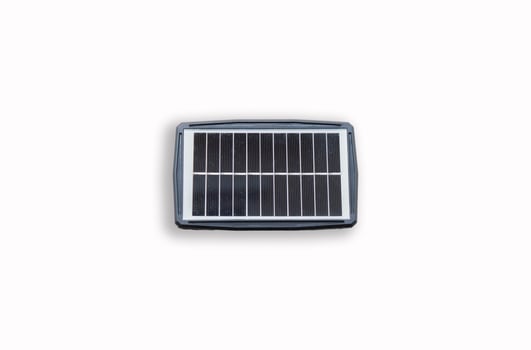 Portable solar panel isolated on white background. Small solar battery cell panel. photo