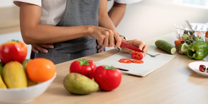 Couple Enjoying Cooking Experience. Preparing fresh ingredients together in a cozy kitchen. photo