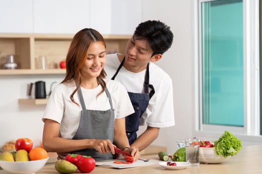 Couple Sharing Cooking Moments. Engaging in meal preparation with love and laughter. photo