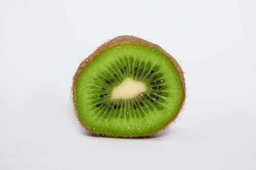 close up of a kiwi fruit on a white background photo