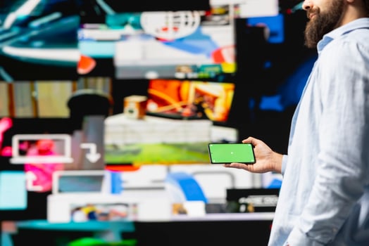 Young influencer checks phone with mockup screen for activity on social media platforms, leveraging innovation and mobile technology to maintain engagement and build a community. Social network. photo