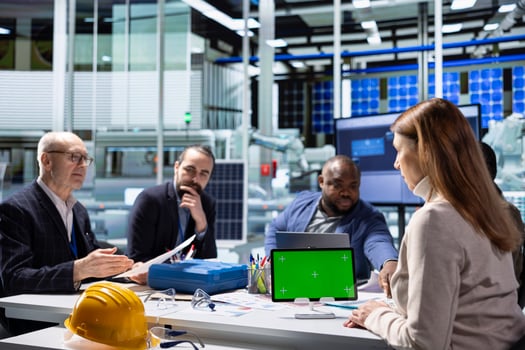 Industrial plant company management executive presents operational insights found during research and development and business strategies to investors using green screen tablet photo
