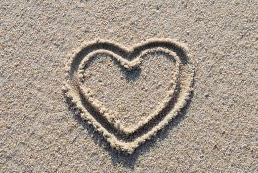 a heart painted in sand photo
