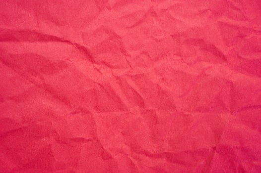 Full frame shot of crumple red paper sheet texture and background. photo