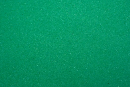 Full frame shot of recycled green paper sheet texture and background. Colored paper or construction paper, is a type of paper that comes in a wide range of colors. photo