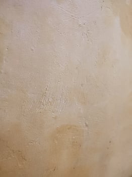 a close up of a wall with a white paint photo