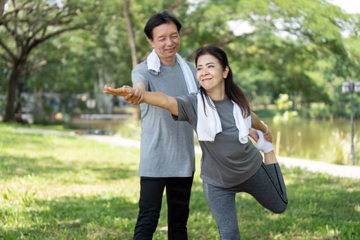 Couple enjoying outdoor fitness together in a park photo