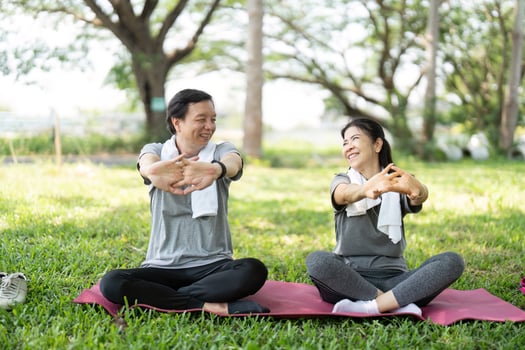 Couple sharing joyful moments during yoga practice photo