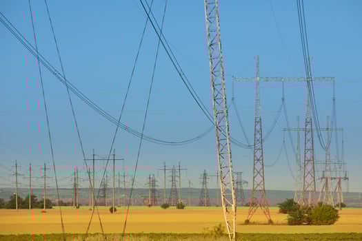 Utility Towers and Cables Silhouetted Against the Afternoon Sky photo