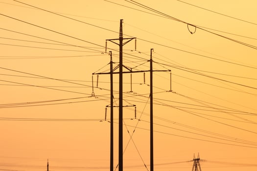 Electricity Pylons Standing Tall Against a Bright Sky photo