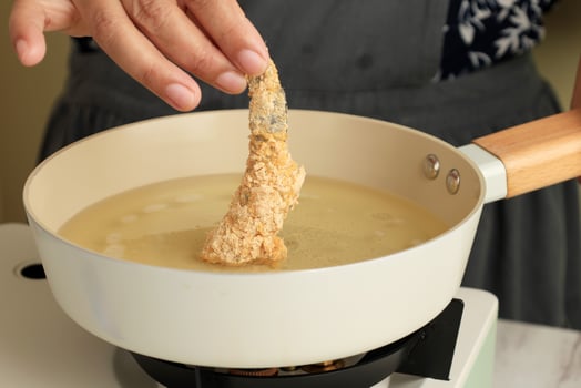 Chef frying prawns in oil photo