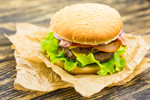 Closeup of homemade hamburger with fresh vegetables photo