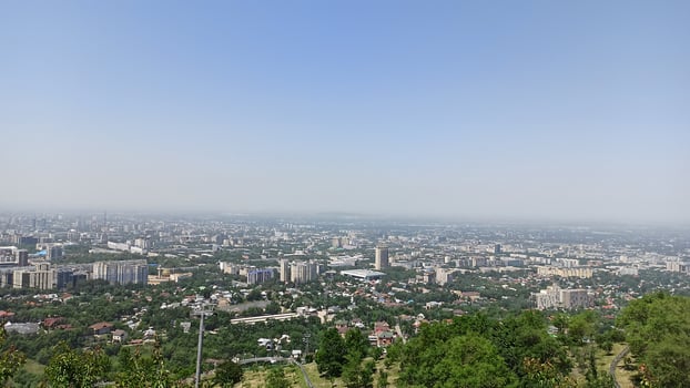 View of Almaty city from above the mountains photo