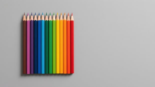 Colorful pencils arranged on gray background photo