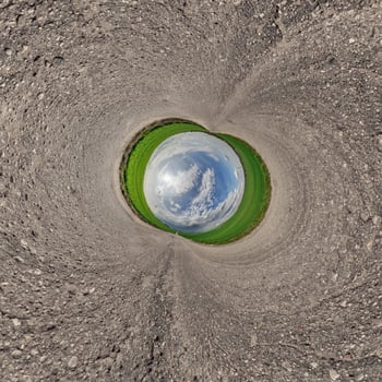 A view of a green field from inside a hole photo