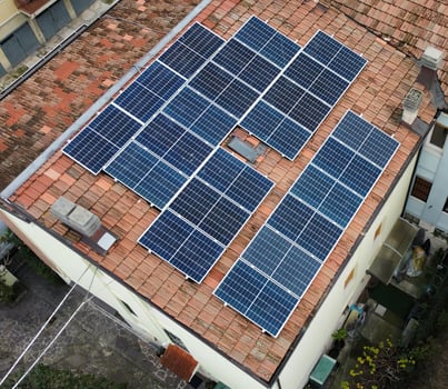 Aerial view of solar panels on roof. Alternative energy concept. photo