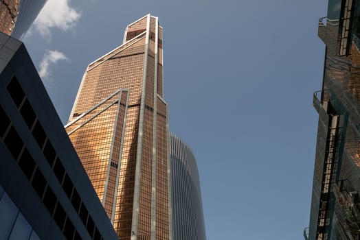 Moscow City Skyline Features Modern Architecture With Towering Skyscrapers Under a Clear Blue Sky During Daylight Hours photo