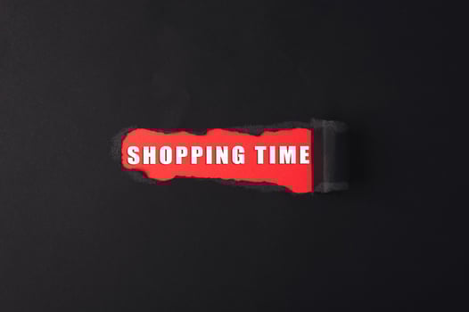 Red and black sign that says shopping time photo