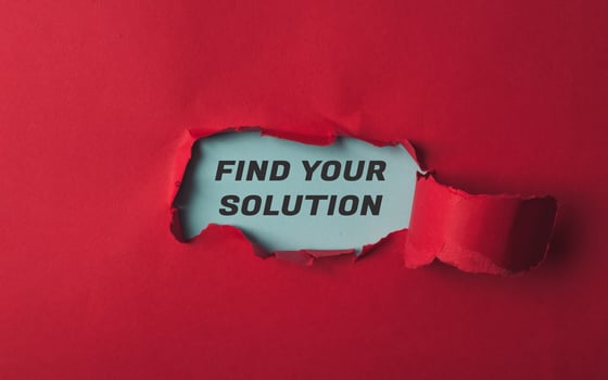 Torn red paper with words Find your solution symbolizing challenge and determination photo