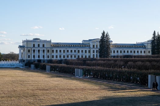 Historic Mansion Surrounded by Manicured Gardens on a Clear Day in Early Spring photo