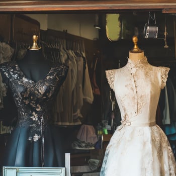 Elegant bridal dresses displayed in a boutique photo
